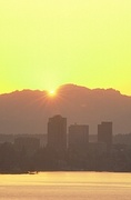 Sun peeking behind Clounds Magnet